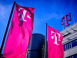Telekom flag in front of headquarter building