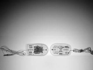 two x-rays, a computer mouse with wiretapping technology on the left, without on the right