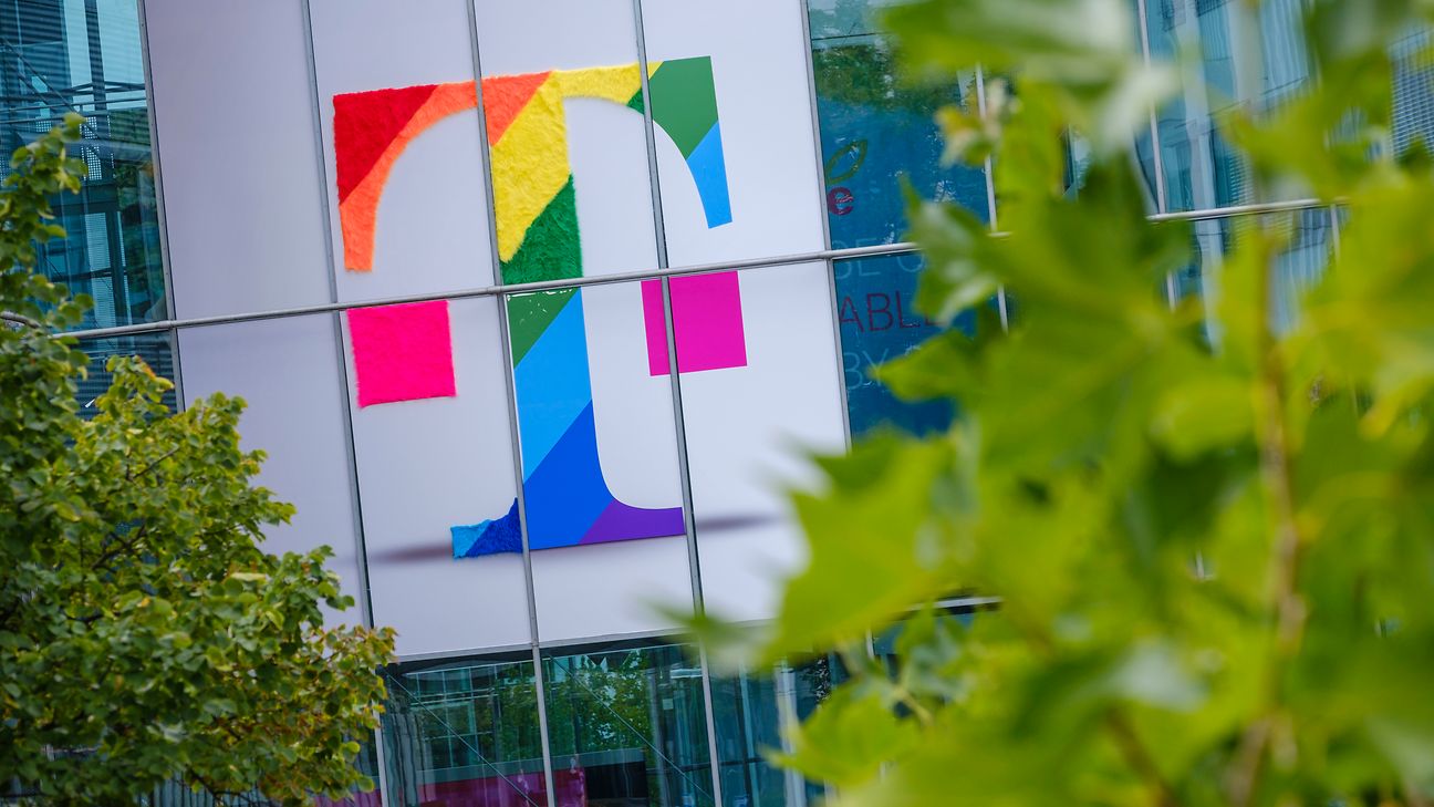 Deutsche Telekom logo in rainbow colors on the facade of an office building 