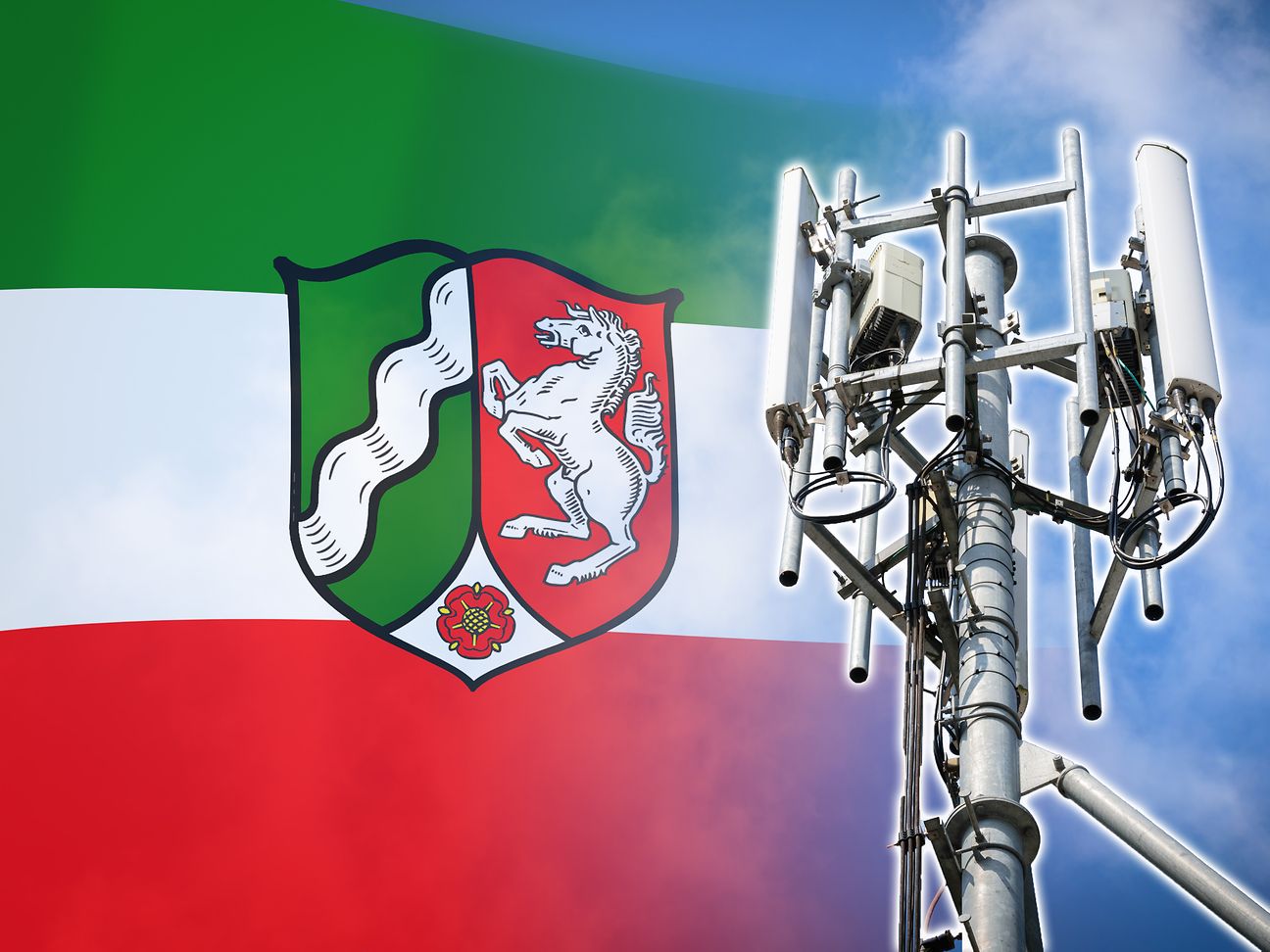 Mobilfunkmast mit Flagge des Landes NRW. 