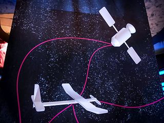 Communication between antenna system and satellite