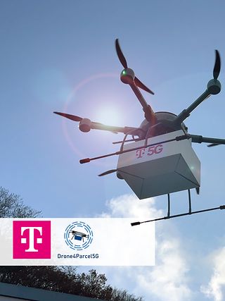 A flying drone in the sky transports a white package with a "T5G" label on it.