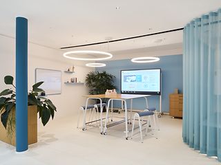 In the office area of the T Gallery, there is a workstation that exemplifies hybrid working.