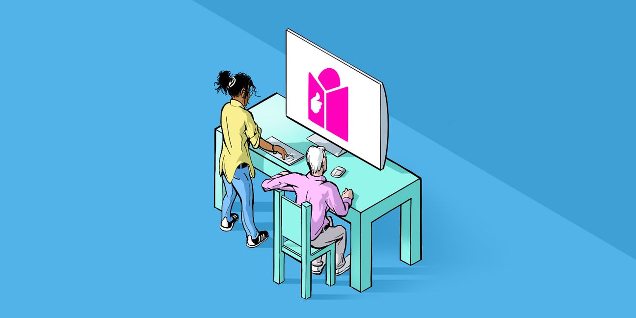 Zwei Menschen vor einem Computer. 