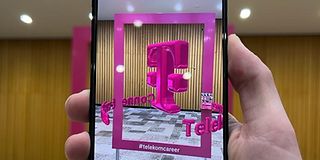 A cell phone screen with the Telekom logo