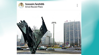 Aufnahme vom Ernst-Reuter-Platz mit einer Skulptur im Vordergrund und einem Hochhaus mit T-Logo im Hintergrund