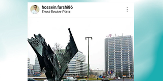 Aufnahme vom Ernst-Reuter-Platz mit einer Skulptur im Vordergrund und einem Hochhaus mit T-Logo im Hintergrund