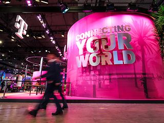 View of Deutsche Telekoms stall at MWC 2024 with slogan "Connecting your world".