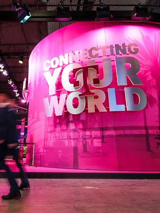 View of Deutsche Telekoms stall at MWC 2024 with slogan "Connecting your world".
