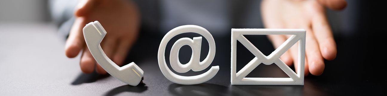 Symbols for telephone, e-mail and letter.