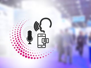 Simultanübersetzer der Telekom: Untertitelung in Echtzeit und Übersetzung in mehr als 100 Sprachen. 