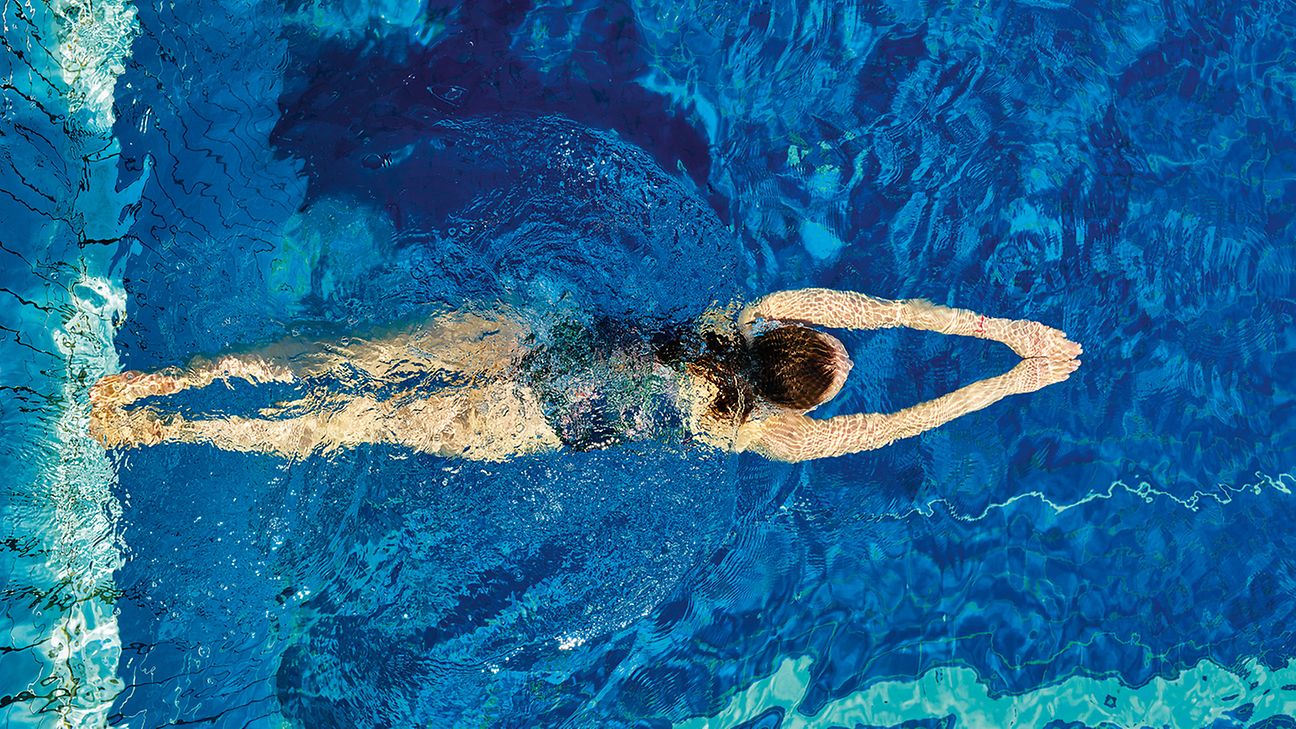 One person swimming in a pool, viewed from above