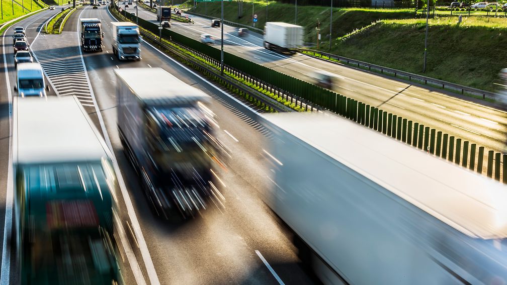 Illustration: Highway with heavy weight trucks.