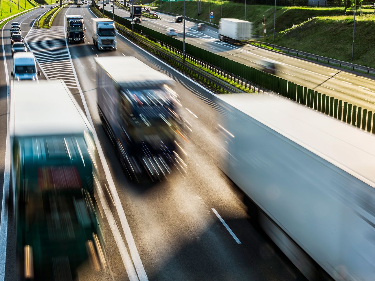 Illustration: Highway with heavy weight trucks.