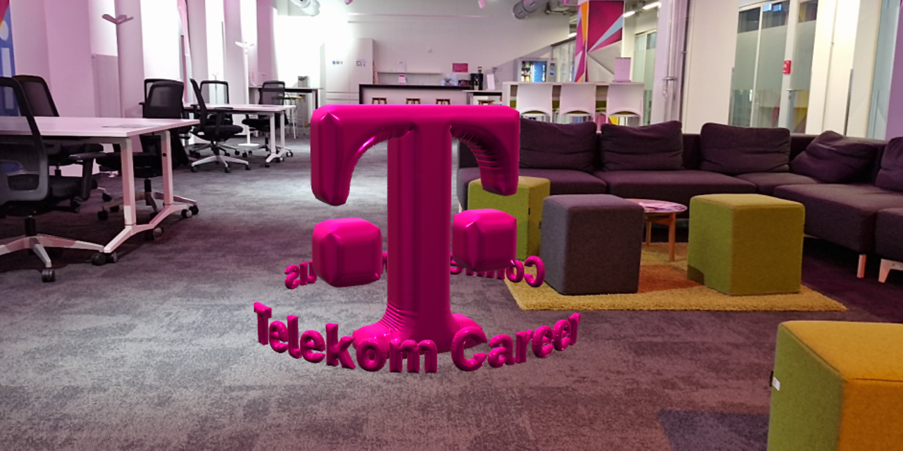 In einem Büro schwebt zwischen Möbeln das T Logo als AR Objekt im Balloneffekt mitten im Raum 