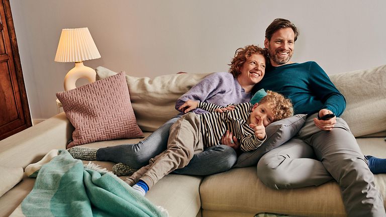 Family sitting on the couch.