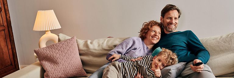 Family sitting on the couch.