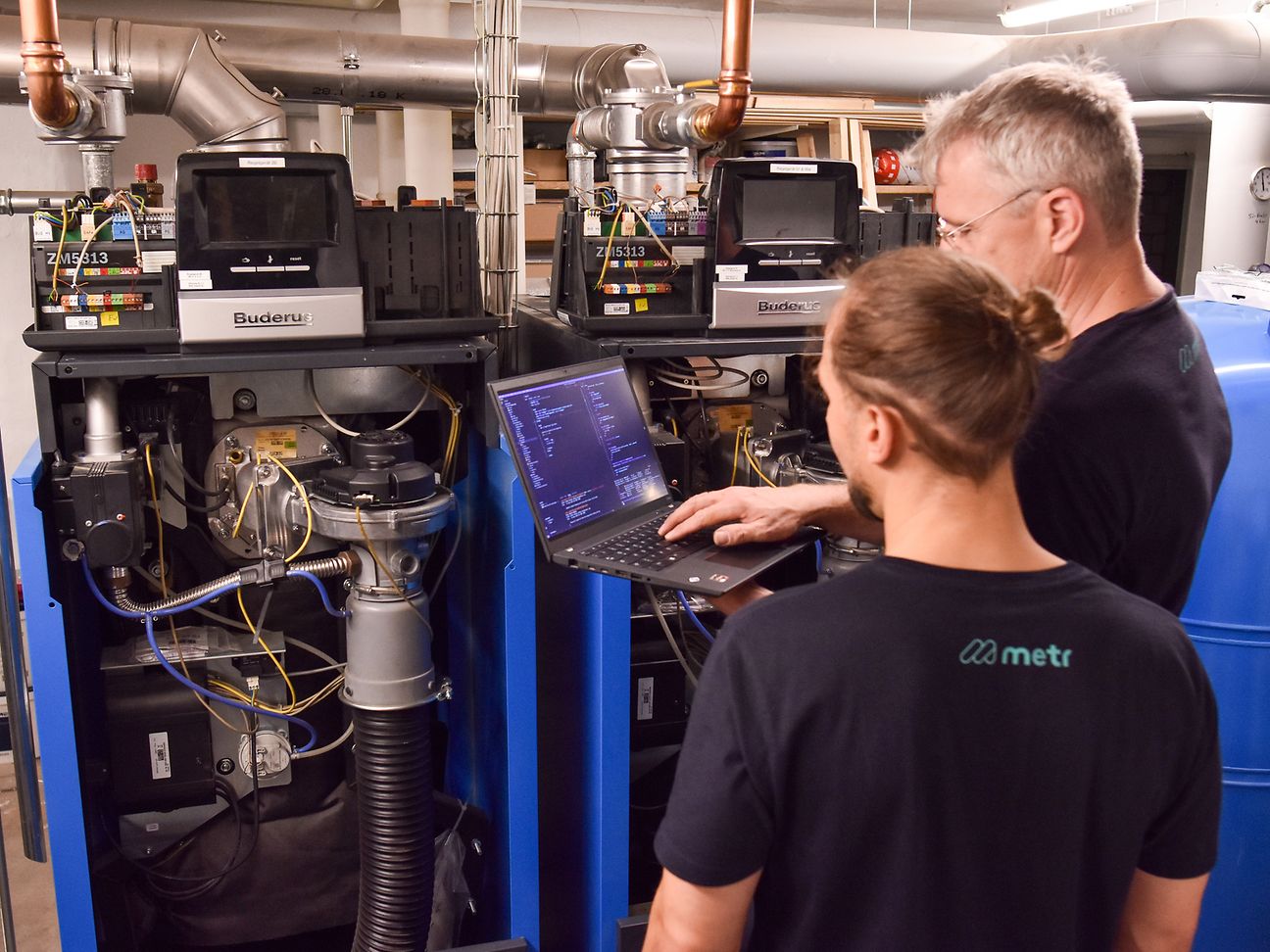 Technicians in the boiler room.