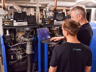 Technicians in the boiler room.