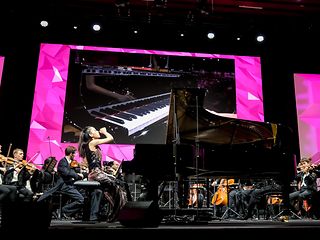 Zhouhui Shen playing the piano. 