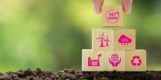 Five wooden blocks represent building blocks for climate neutrality.