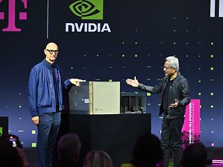 Jensen Huang (CEO NVIDIA) and Tim Höttges (CEO Deutsche Telekom) present a GPU model during the press conference.