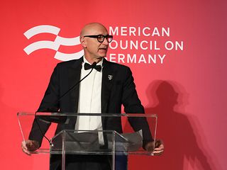 Tim Höttges on stage.