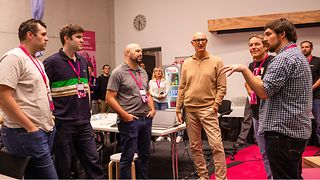 CEO Tim Höttges in talks with participants.