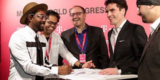Signing of the contract in Barcelona with i.am+ and Deutsche Telekom.
