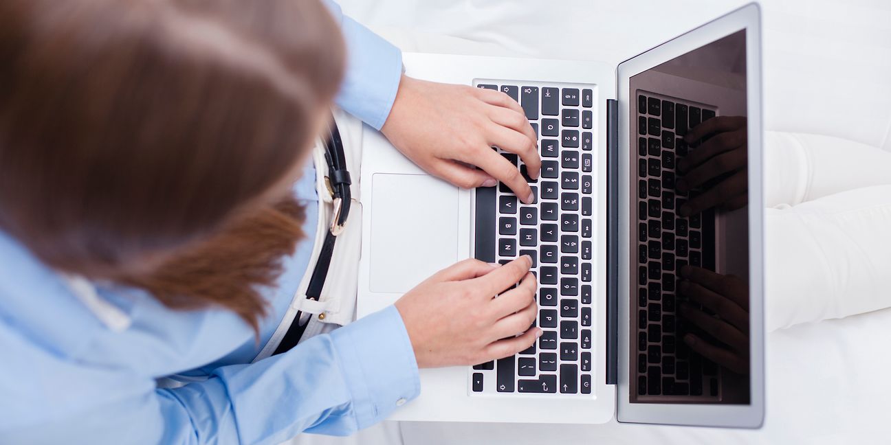 Woman working at laptop.