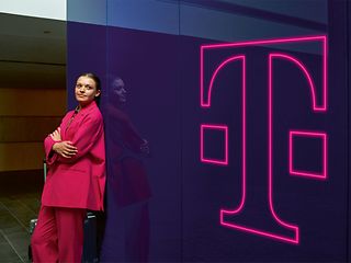 Woman next to Telekom logo