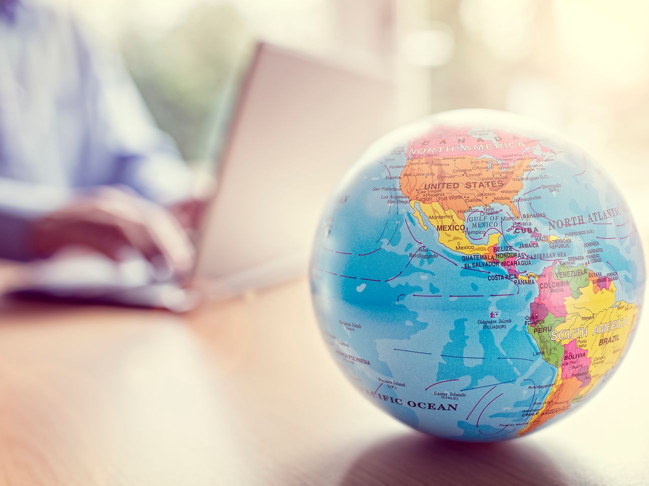 Globe in front of laptop