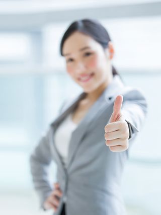 Woman showing "thumbs up".