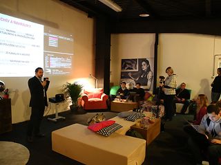 Explaining the features of Magio TV at a casual “sofa” press conference.