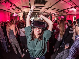 Concert-goer with virtual reality headset