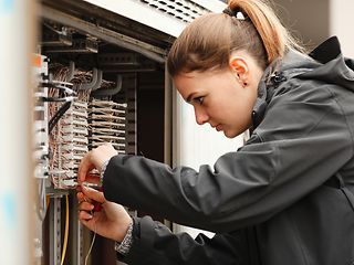 Technician working at a switchbox