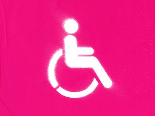 White symbol of a wheelchair user on a magenta background.