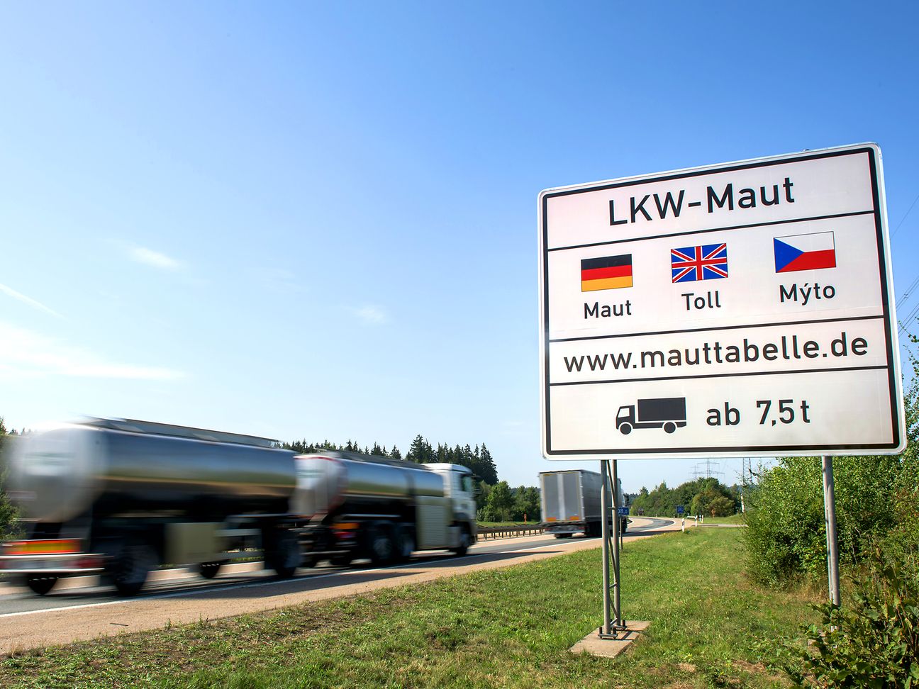 Truck on highway, toll sign Truck on highway, toll sign