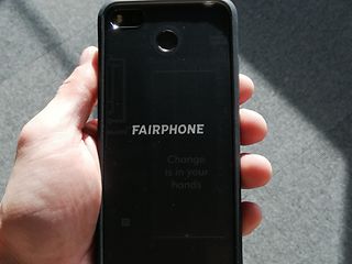 Fairphone in hand.