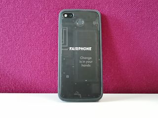Fairphone from behind in front of magenta wall.