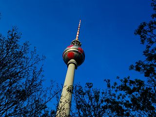 Berlin's TV tower as a magenta-colored soccer ball.