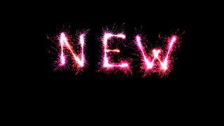 Symbol image: The word "new," formed from sparklers. 