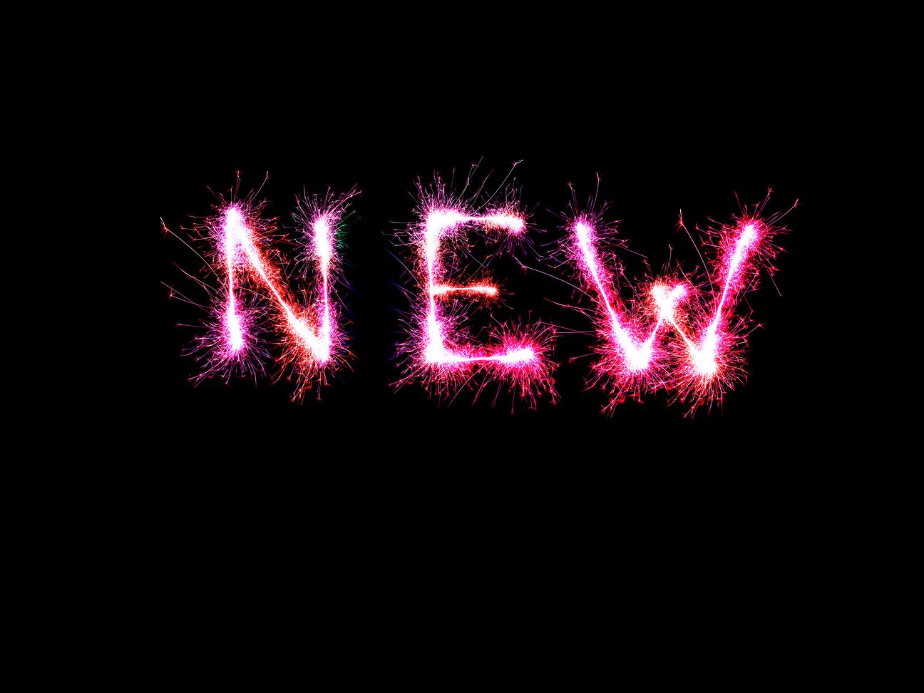 Symbol image: The word "new," formed from sparklers. 
