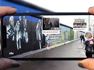 Picture of the Berlin Wall with extra superimposed virtual content.