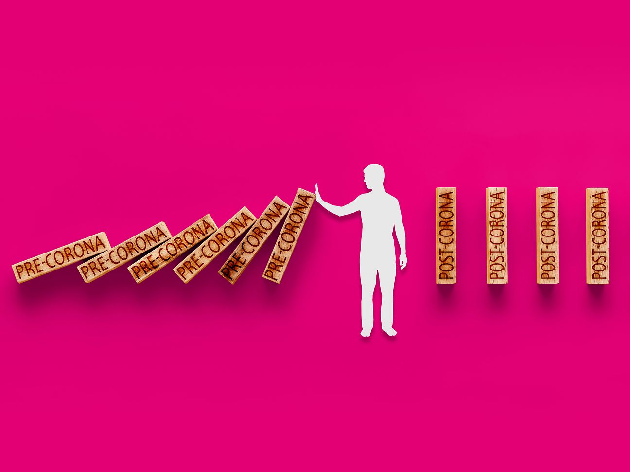 Someone holds dominoes labelled Pre-Corona, which fall over, behind him are dominoes labelled Post-Corona.