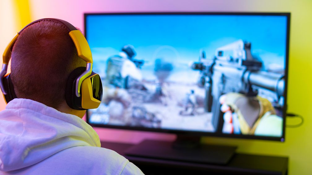 Young man playing computer game.
