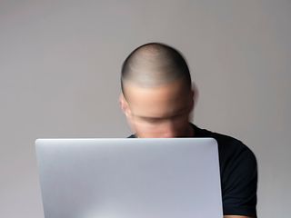 Man in front of a laptop
