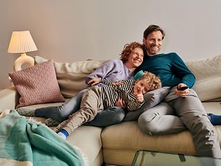 Family sitting on the couch.